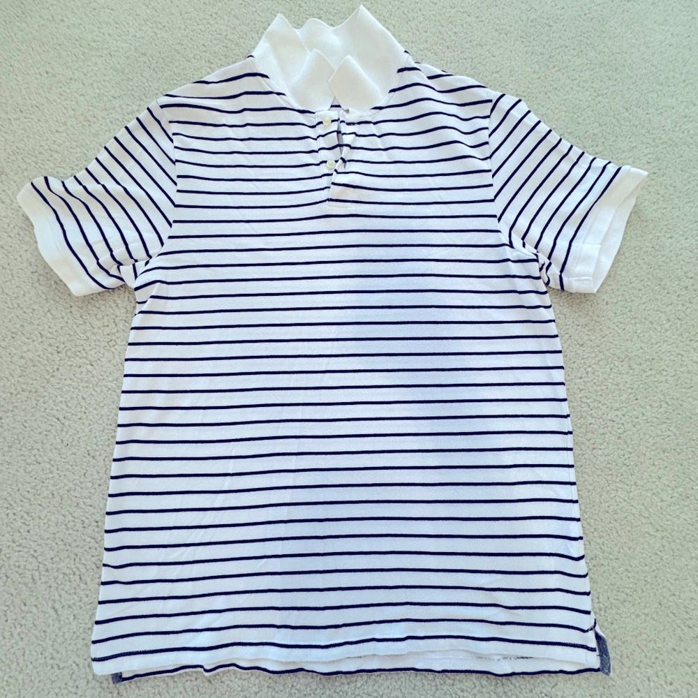 White polo shirt with black lines.